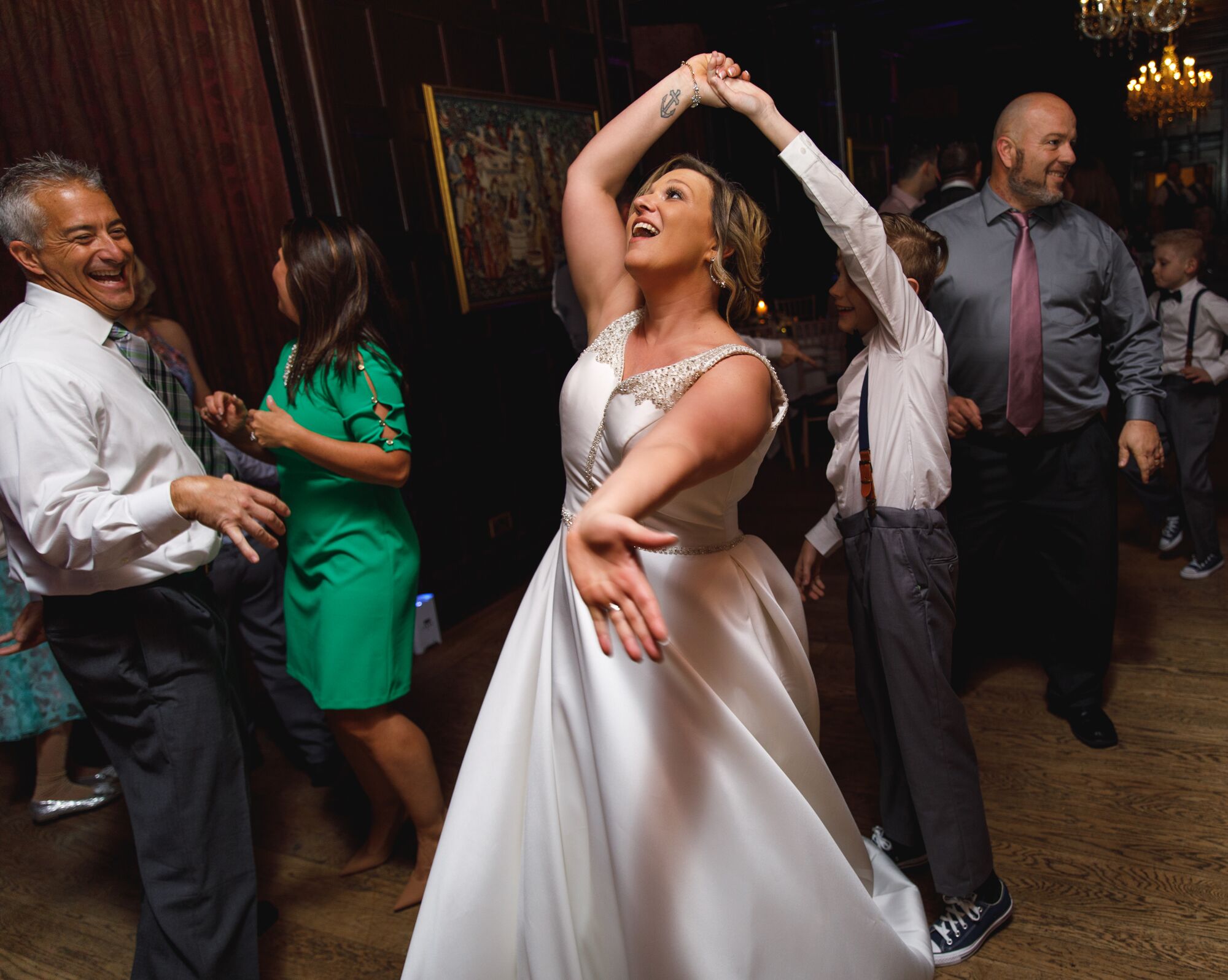 A happy bride dancing at Bartley Lodge Hotel;