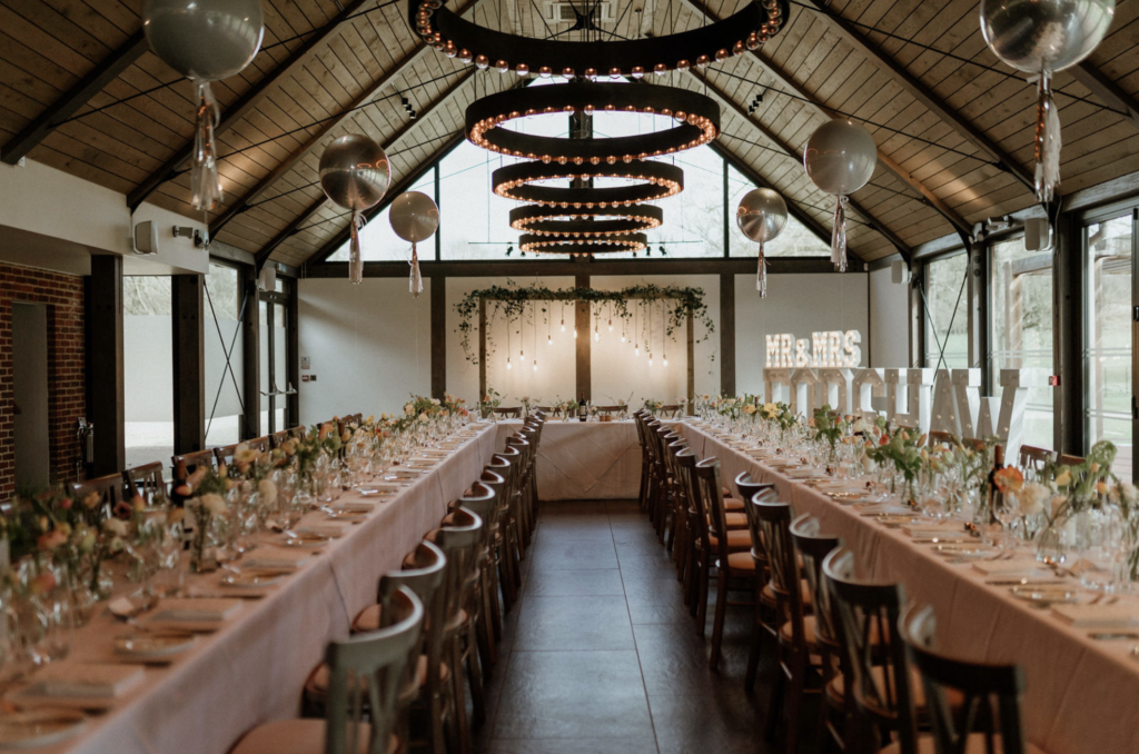 The Farm Barn At Syrencot set up for a wedding breakfast