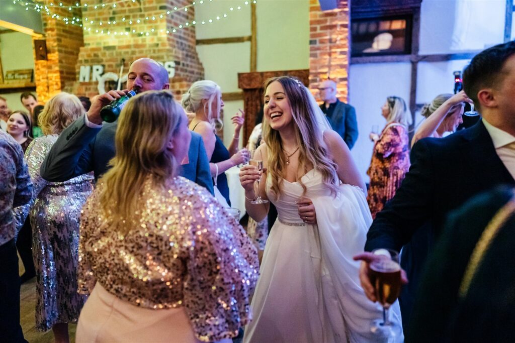 Happy bride dancing at Lainston House
